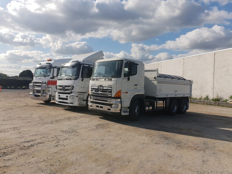 Hino, Mercedes and Mack trucks with tipping tray truck bodies